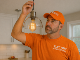 Electrician inspects pendant light fixture